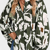 Filomena Blusa con Media Botonadura y Manga Abullonada en Estampado Floral Abstracto